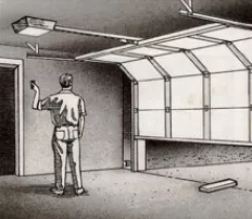 Man closing a garage door with a switch